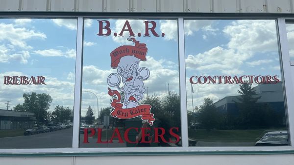 Office window displaying the original B.A.R. Placers logo
